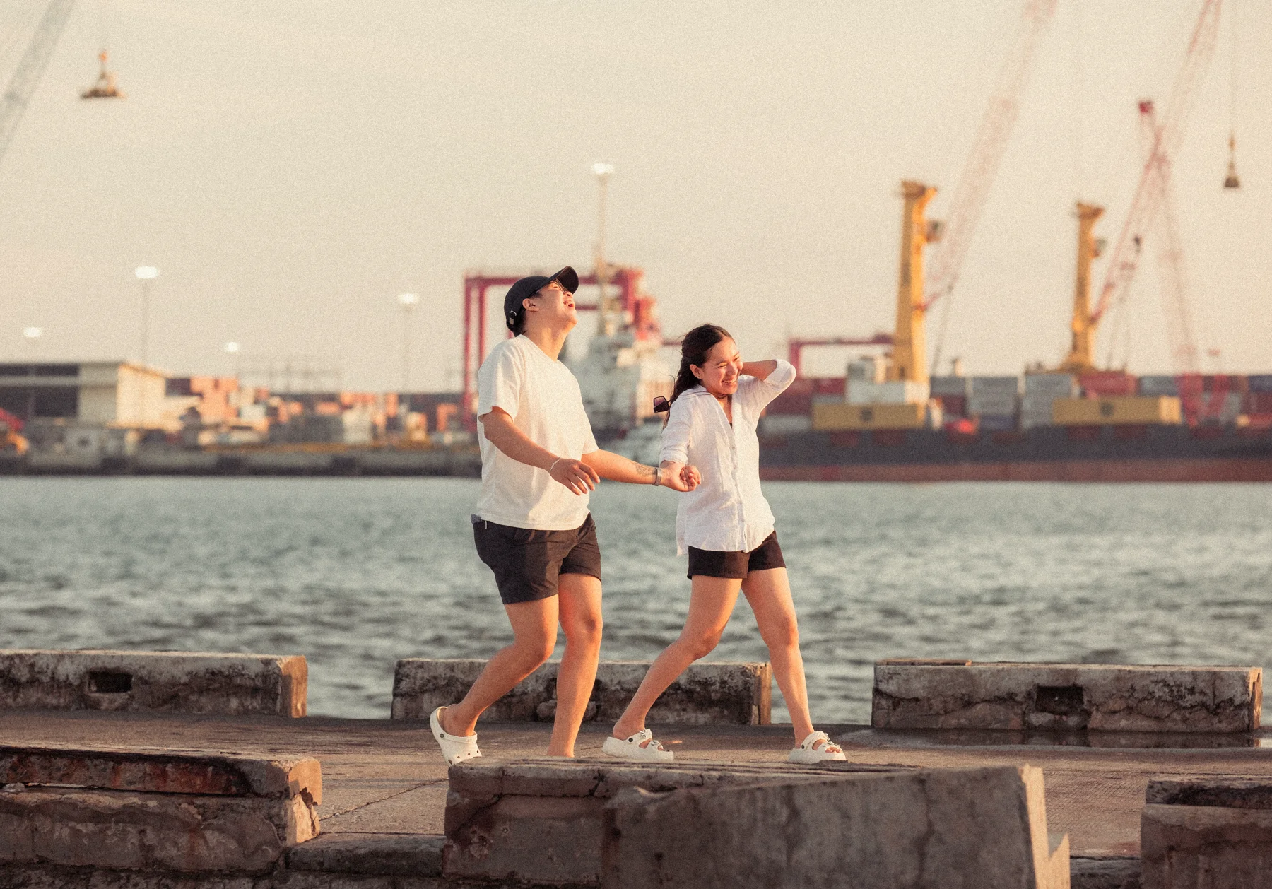 Couple moving naturally by the seaside in Cebu